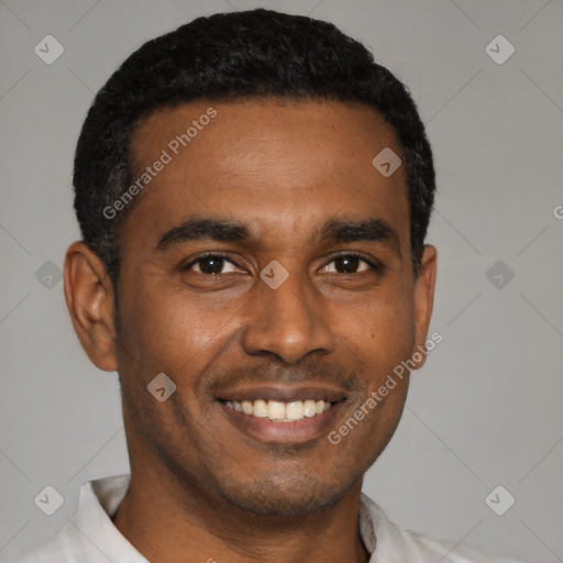 Joyful black young-adult male with short  black hair and brown eyes