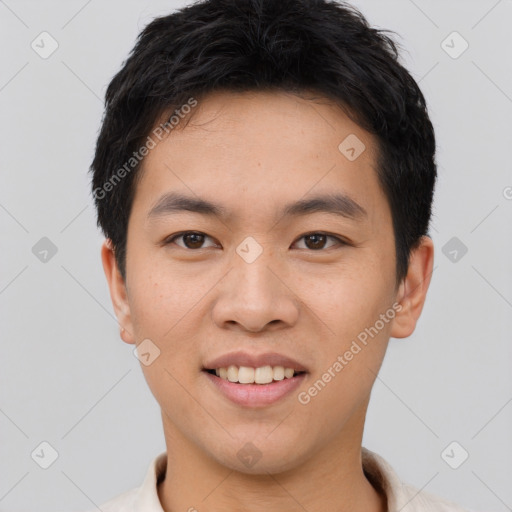 Joyful asian young-adult male with short  black hair and brown eyes