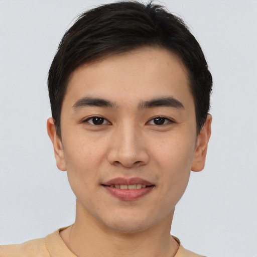 Joyful asian young-adult male with short  brown hair and brown eyes