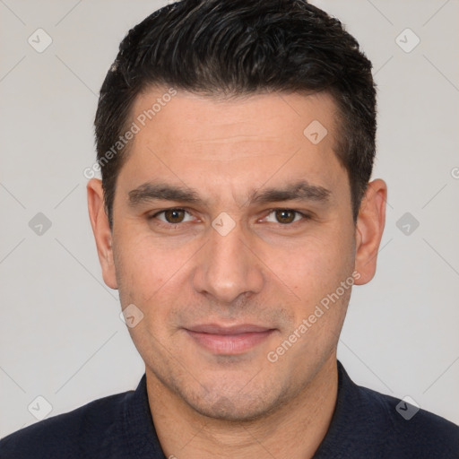 Joyful white adult male with short  brown hair and brown eyes