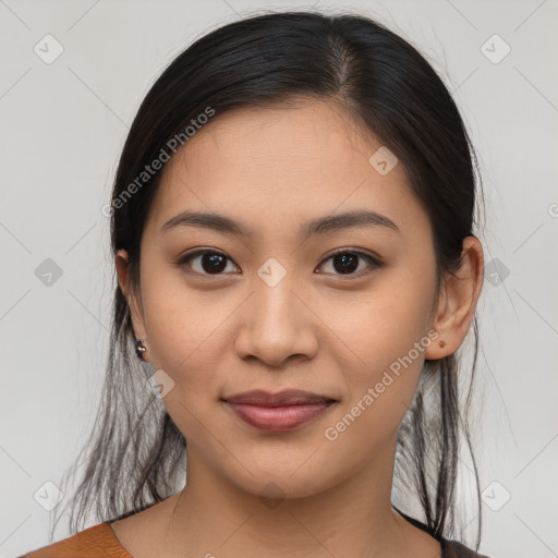 Joyful latino young-adult female with medium  brown hair and brown eyes