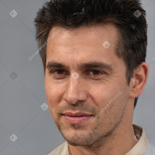 Joyful white adult male with short  brown hair and brown eyes