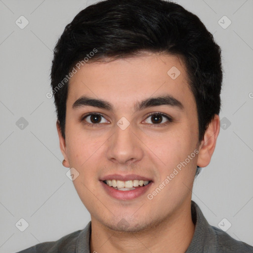 Joyful white young-adult male with short  black hair and brown eyes