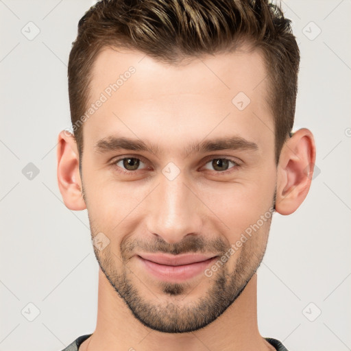 Joyful white young-adult male with short  brown hair and brown eyes