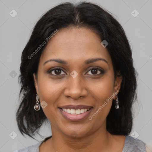 Joyful black young-adult female with medium  brown hair and brown eyes