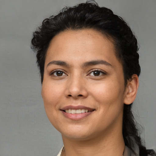 Joyful white young-adult female with short  black hair and brown eyes