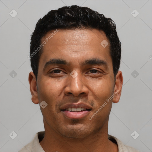 Joyful latino young-adult male with short  black hair and brown eyes