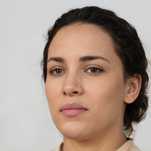 Neutral white young-adult female with medium  black hair and brown eyes