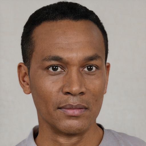 Neutral black young-adult male with short  black hair and brown eyes