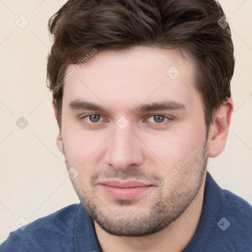 Neutral white young-adult male with short  brown hair and brown eyes