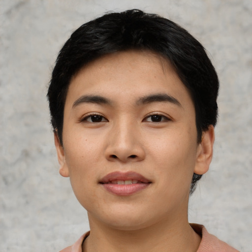 Joyful asian young-adult female with short  black hair and brown eyes
