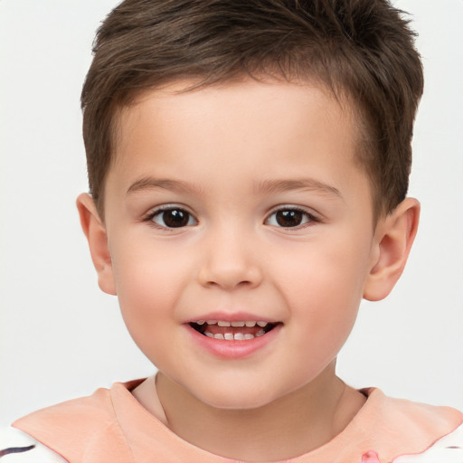 Joyful white child male with short  brown hair and brown eyes