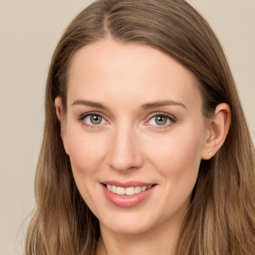 Joyful white young-adult female with long  brown hair and grey eyes