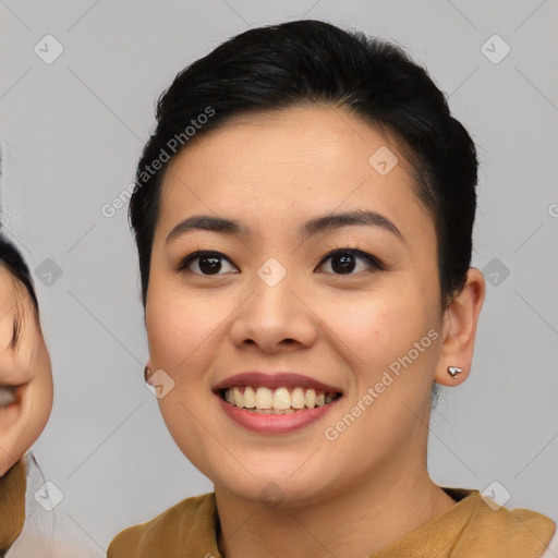 Joyful asian young-adult female with short  black hair and brown eyes