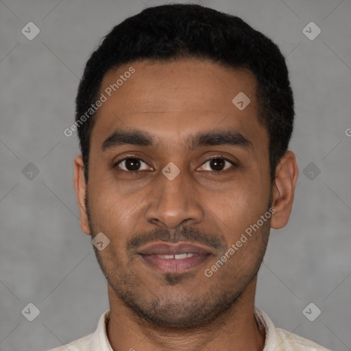 Joyful latino young-adult male with short  black hair and brown eyes