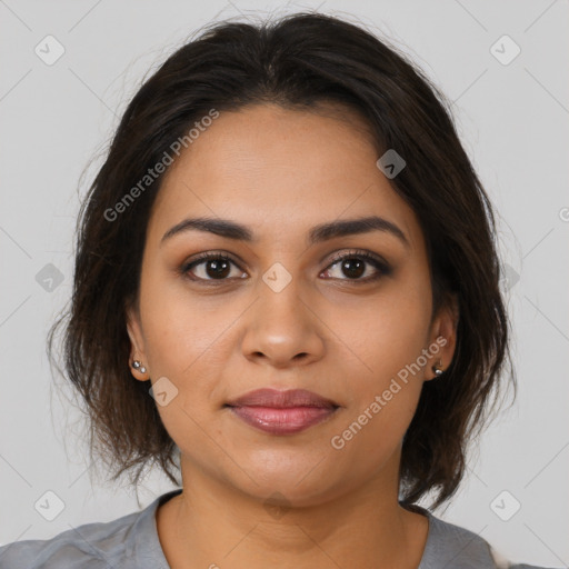 Joyful latino young-adult female with medium  brown hair and brown eyes