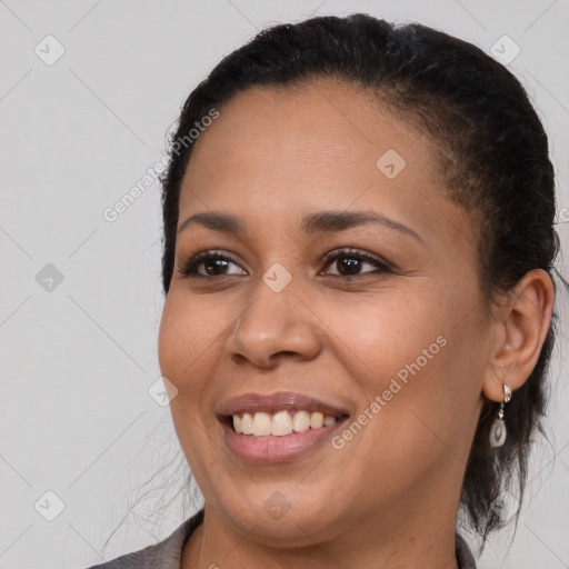 Joyful black young-adult female with medium  brown hair and brown eyes