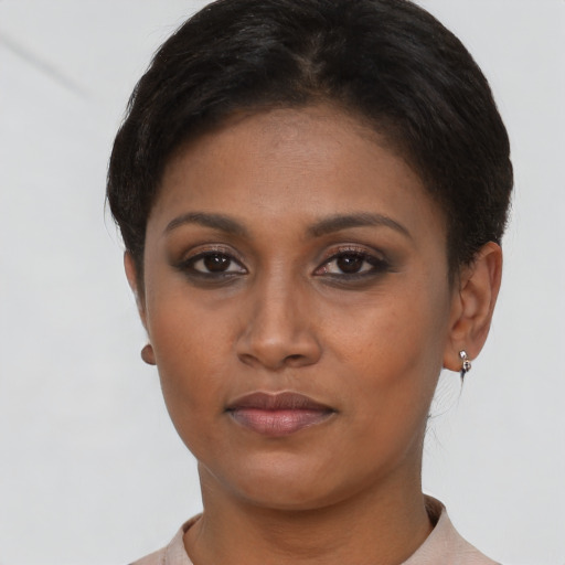 Neutral latino young-adult female with short  brown hair and brown eyes