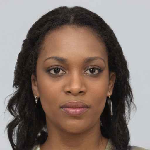 Neutral black young-adult female with long  brown hair and brown eyes