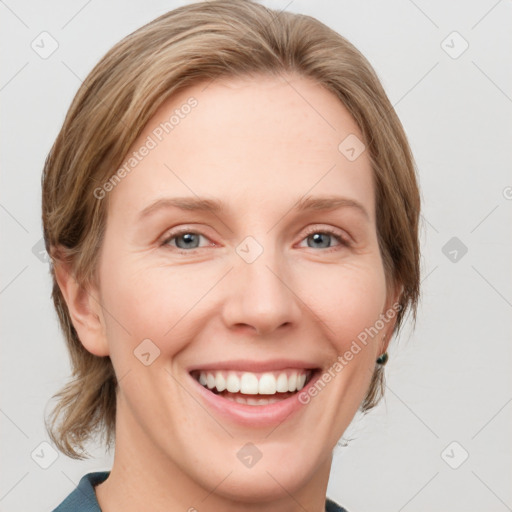 Joyful white young-adult female with medium  brown hair and blue eyes