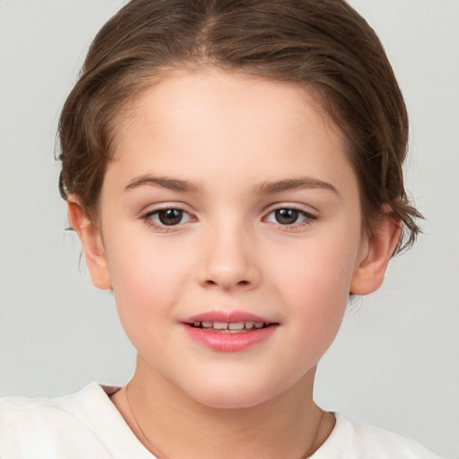 Joyful white child female with short  brown hair and brown eyes