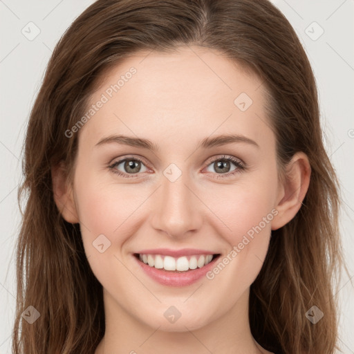 Joyful white young-adult female with long  brown hair and green eyes