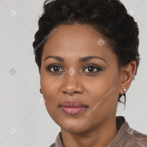 Joyful black young-adult female with short  brown hair and brown eyes