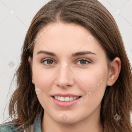 Joyful white young-adult female with long  brown hair and grey eyes