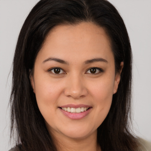 Joyful white young-adult female with long  brown hair and brown eyes