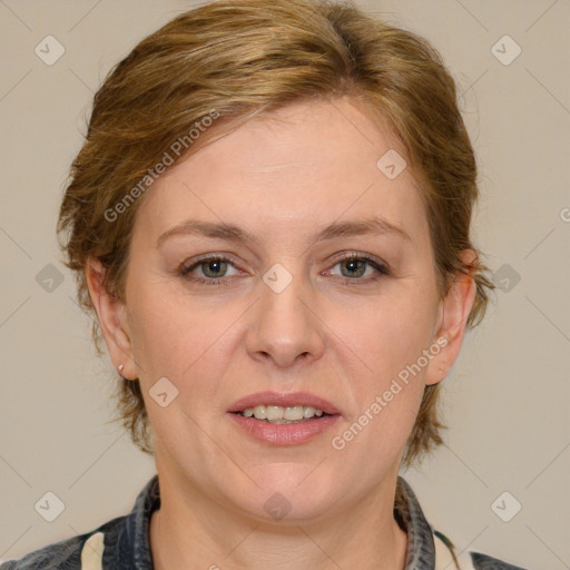 Joyful white adult female with medium  brown hair and grey eyes