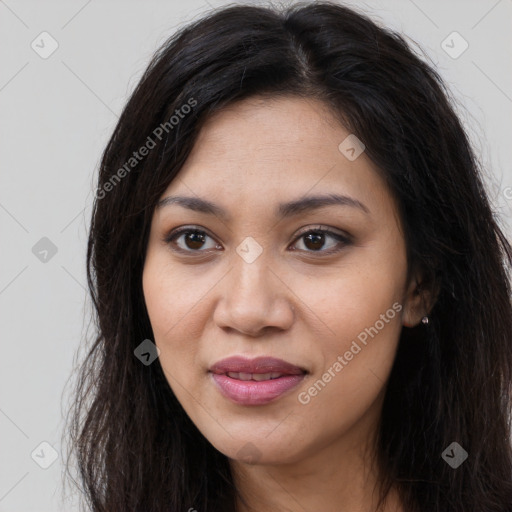 Joyful latino young-adult female with long  brown hair and brown eyes