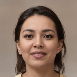 Joyful white young-adult female with medium  brown hair and brown eyes