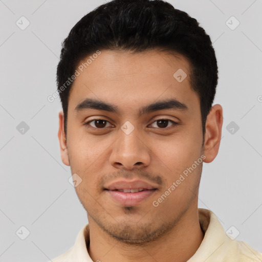Joyful latino young-adult male with short  black hair and brown eyes