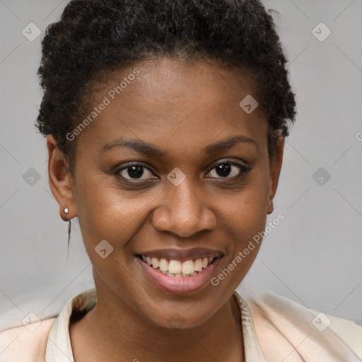 Joyful black young-adult female with short  brown hair and brown eyes