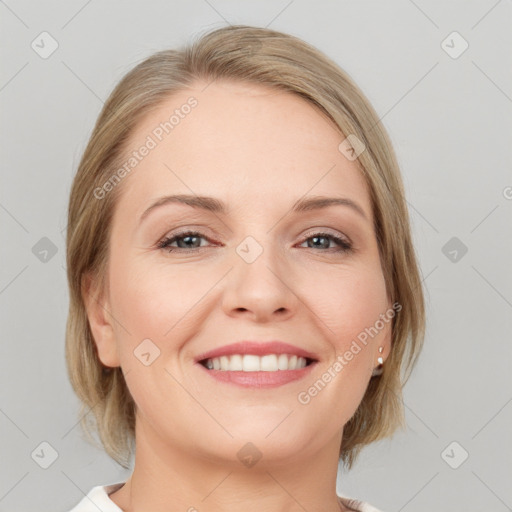 Joyful white young-adult female with medium  brown hair and blue eyes