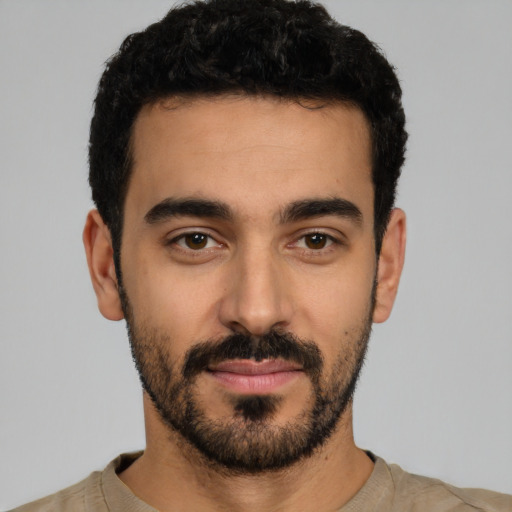 Neutral latino young-adult male with short  black hair and brown eyes