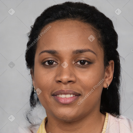 Joyful black young-adult female with medium  black hair and brown eyes