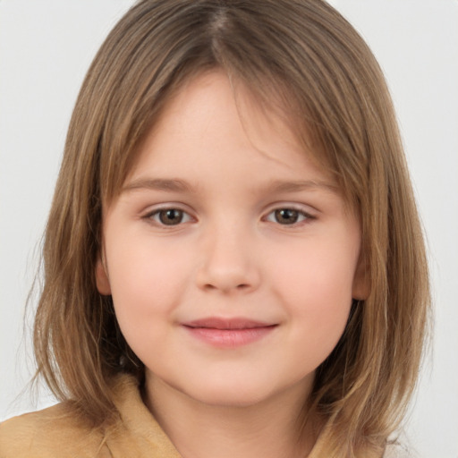 Joyful white child female with medium  brown hair and brown eyes