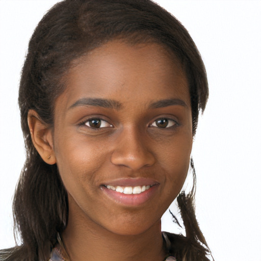 Joyful black young-adult female with long  brown hair and brown eyes