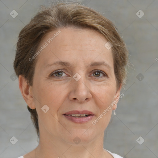 Joyful white adult female with medium  brown hair and brown eyes