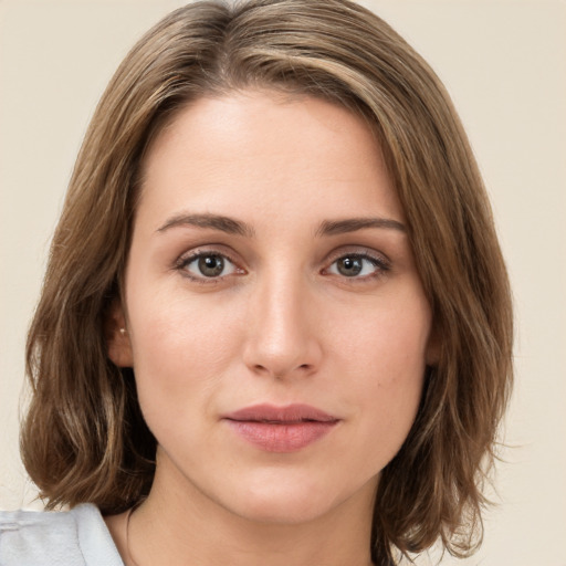 Joyful white young-adult female with medium  brown hair and green eyes