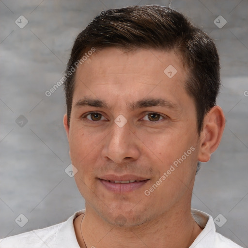 Joyful white adult male with short  brown hair and brown eyes