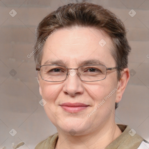 Joyful white adult female with short  brown hair and grey eyes