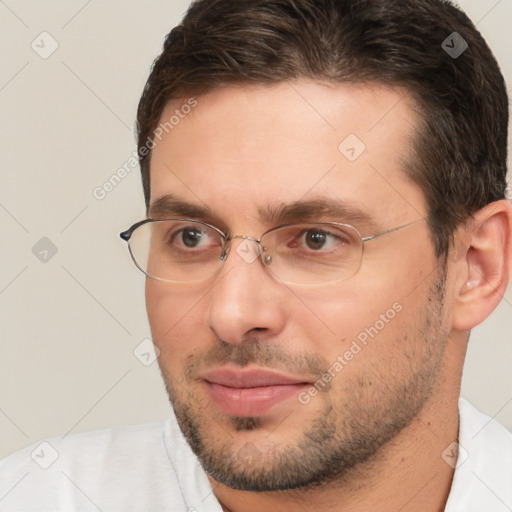 Joyful white adult male with short  brown hair and brown eyes