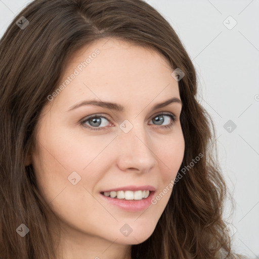 Joyful white young-adult female with long  brown hair and blue eyes