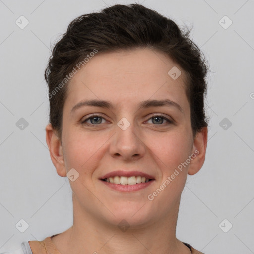 Joyful white young-adult female with short  brown hair and grey eyes