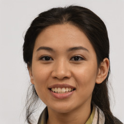 Joyful asian young-adult female with long  brown hair and brown eyes