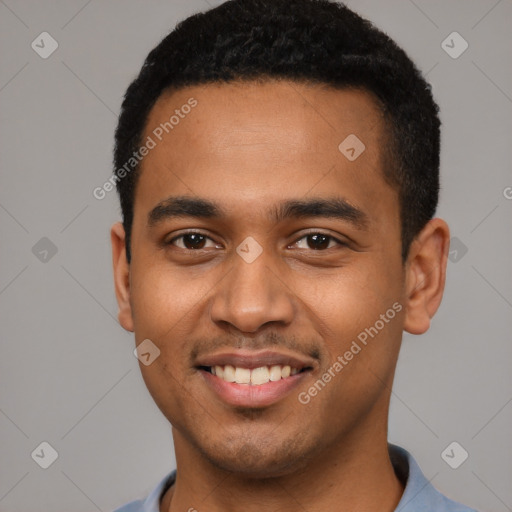 Joyful black young-adult male with short  black hair and brown eyes