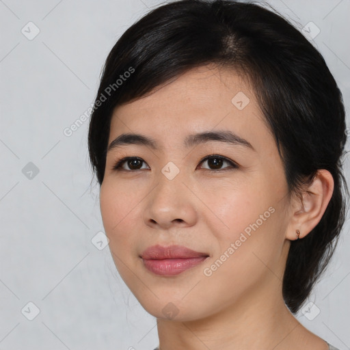 Joyful asian young-adult female with medium  black hair and brown eyes