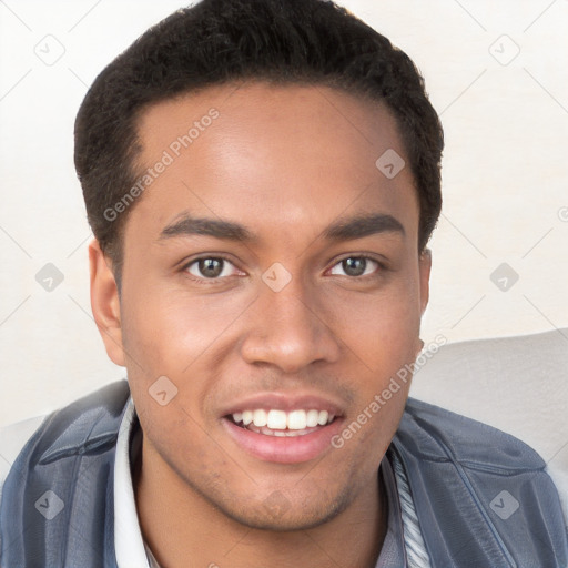 Joyful white young-adult male with short  black hair and brown eyes